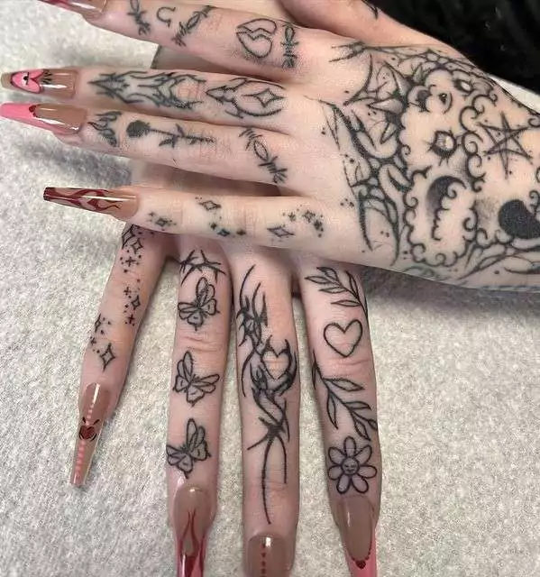 Floral heart tattoo on finger