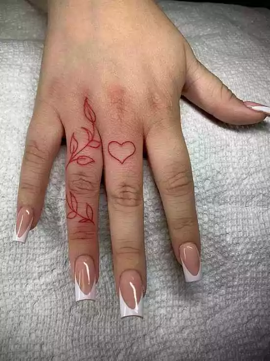 Heart tattoo with leaf