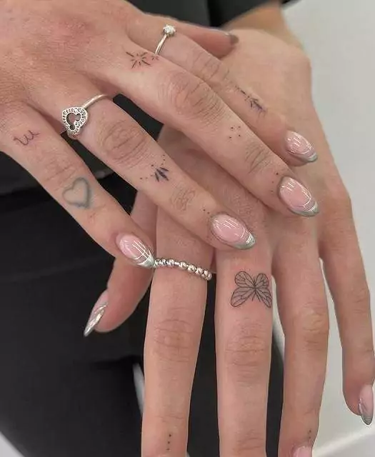 green heart tattoo with butterfly