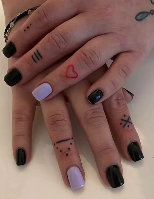 minimalist orange heart tattoo