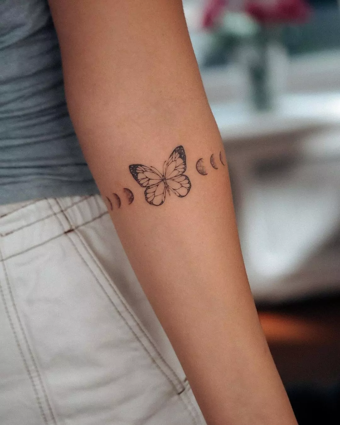 Butterfly With Moon Phase Tattoo