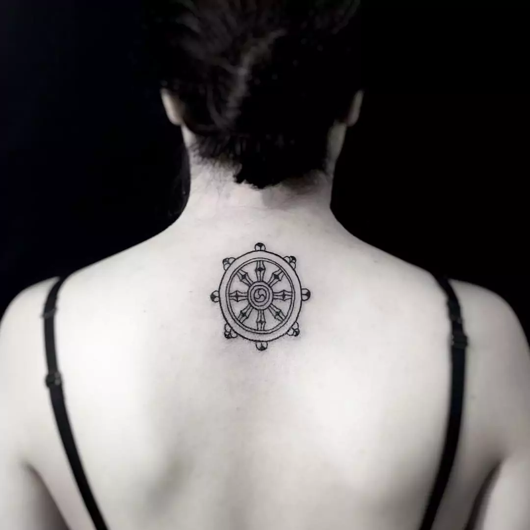 Spiritual Dharma Wheel Tattoo On The Back