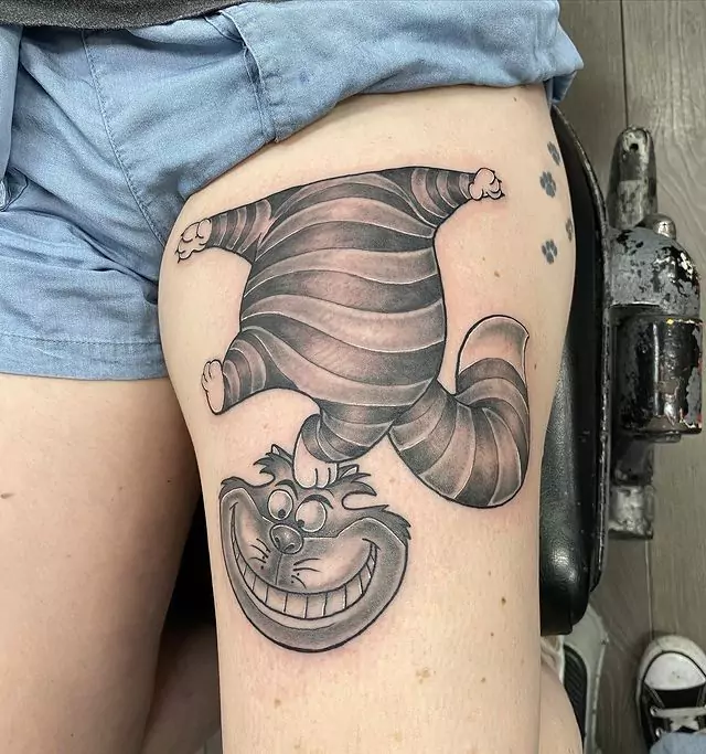 funny black and grey cheshire cat tattoo
