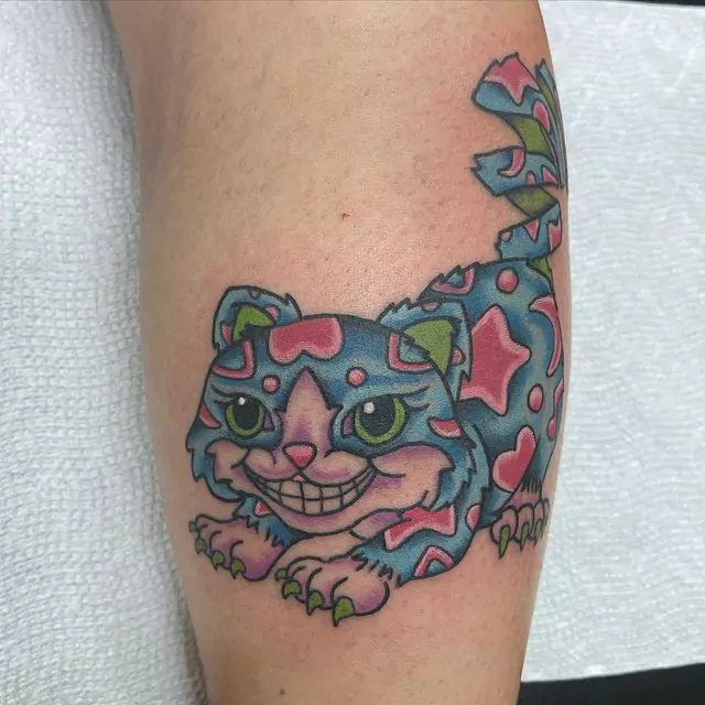 small and cute cheshire cat tattoo