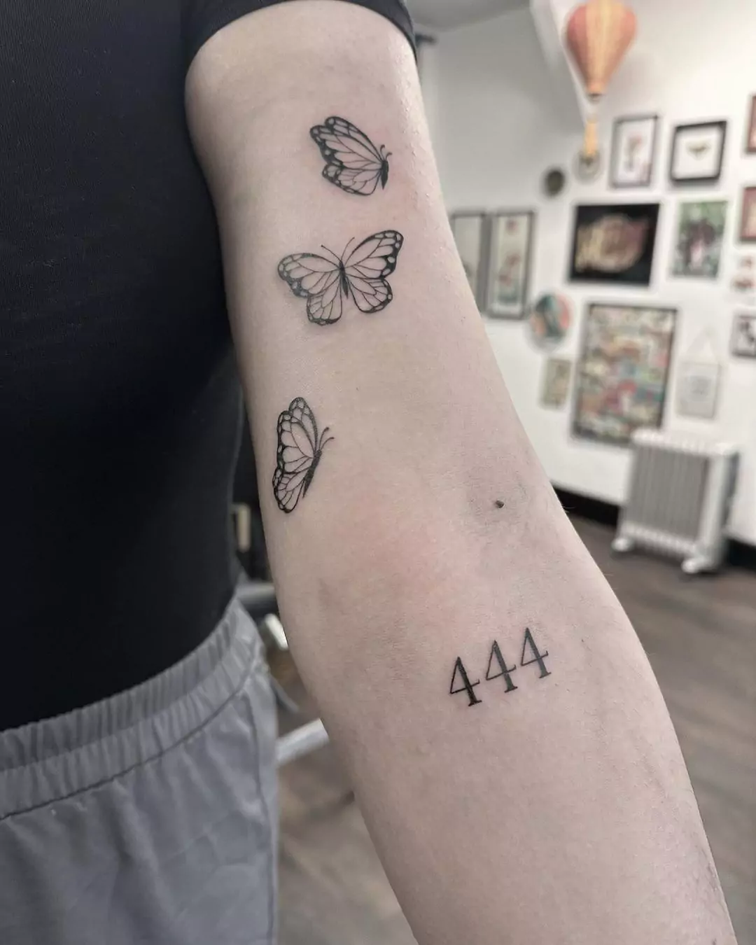 Forearm Butterfly And Angel Number Tattoo