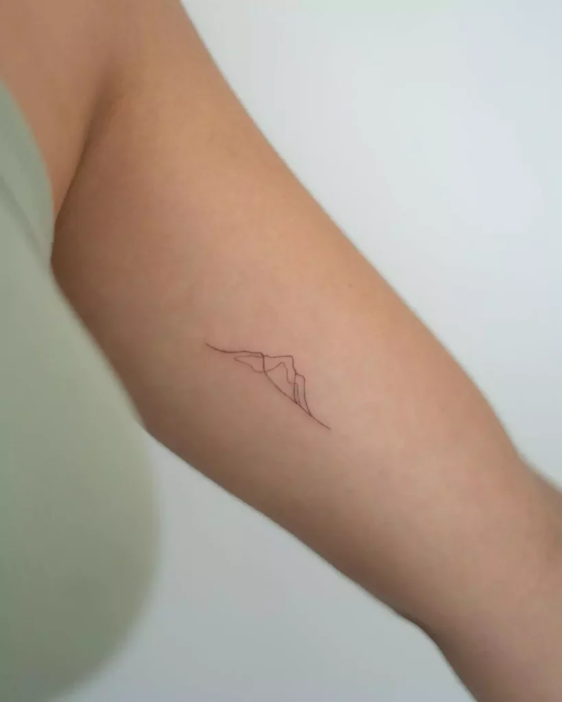 Tiny Mountain hand tattoo