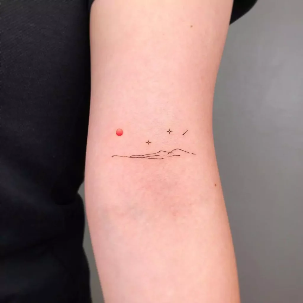 Tiny line mountain hand tattoo
