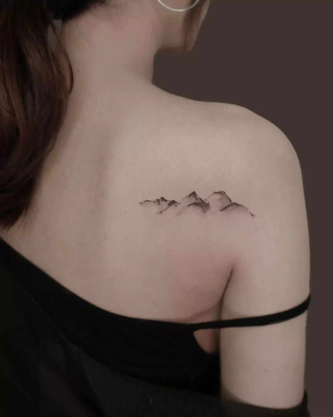 aesthetic mountain tattoo on the back