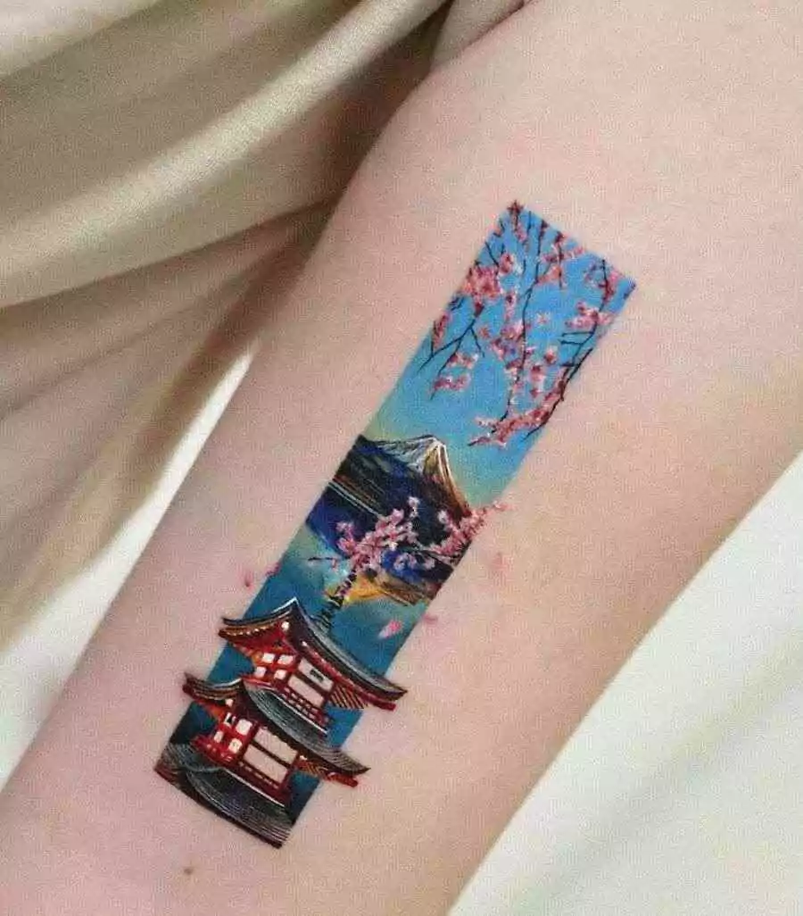 colorful mount fuji tattoo with cherry blossom