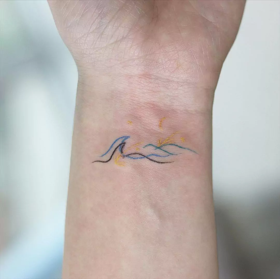 colorful mountain wrist tattoo