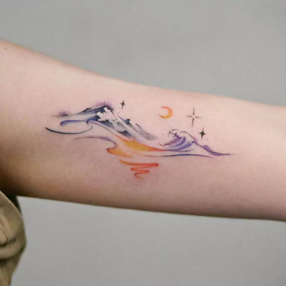 colorful mountains and waves tattoo