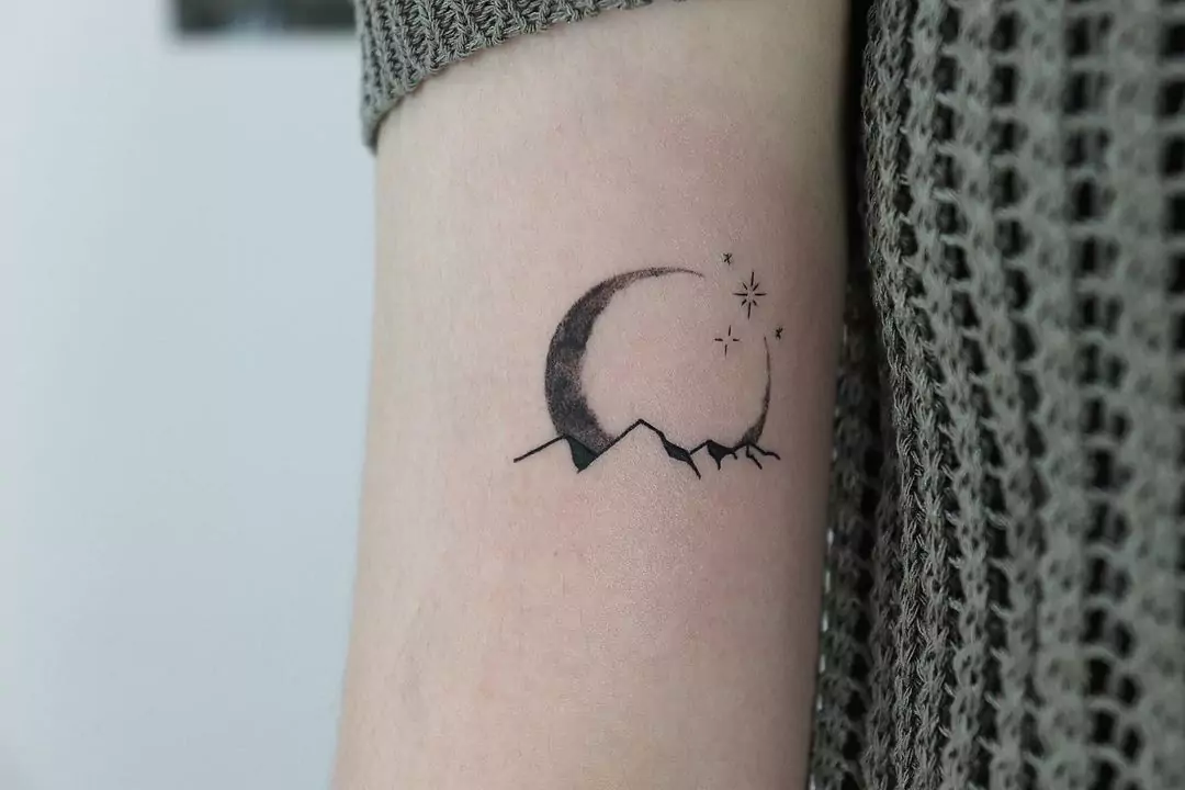 dark creative mountain and moon tattoo