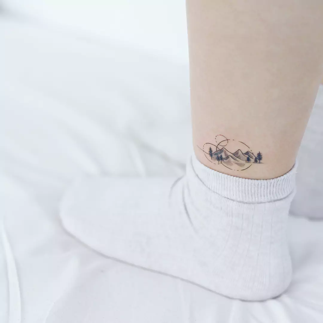 geometric mountain leg tattoo