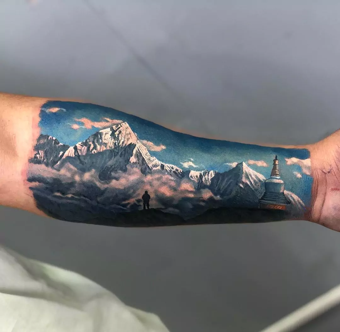 landscape mountain tattoo on the hand