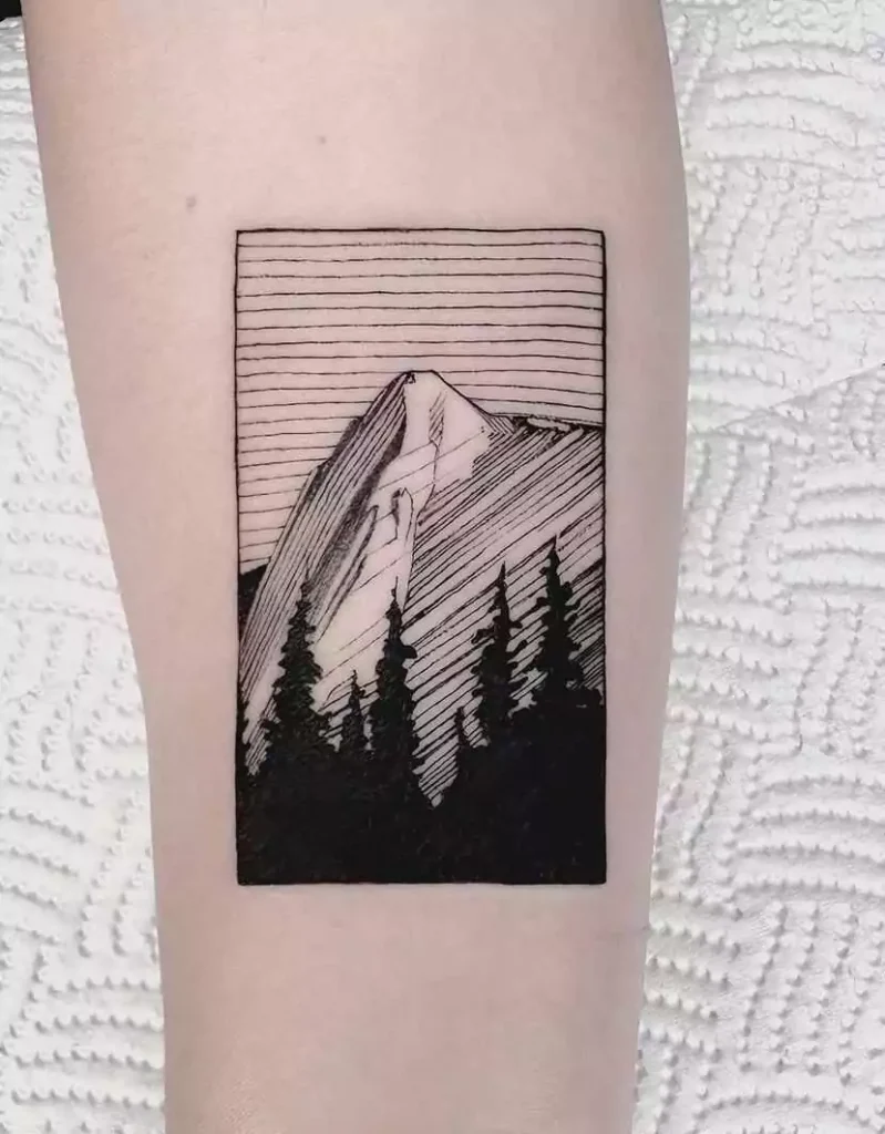 minimalistic mountain tattoo in the frame