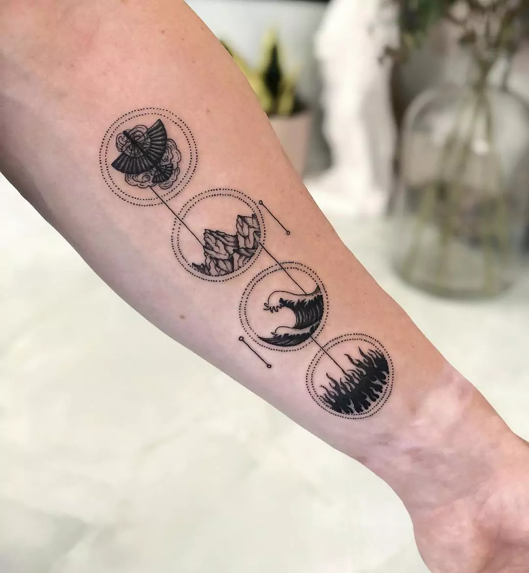 mountain tattoo with multiple elements