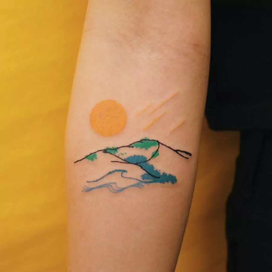 mountain tattoo with sun