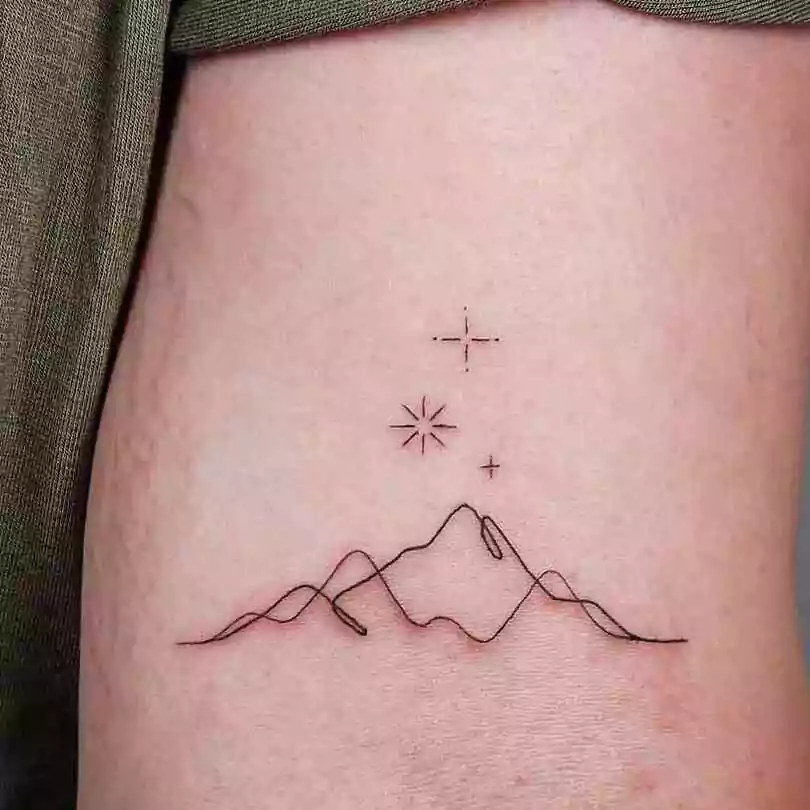simple line minimalistic mountain tattoo