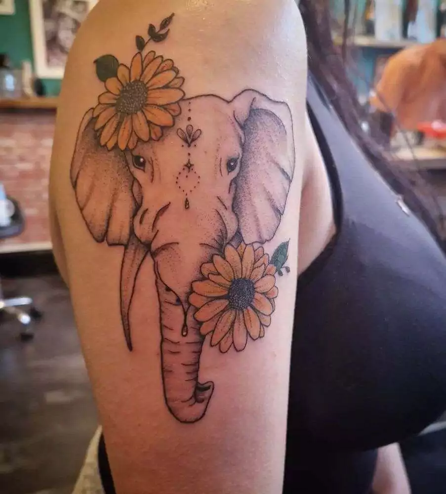 Elephants and flower hand tattoo