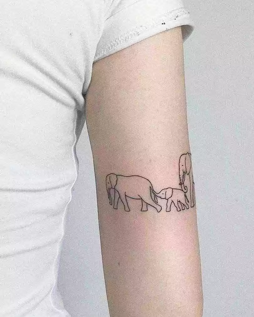 Family elephants hand tattoo