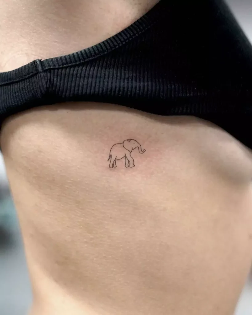 Simple elephant tattoo on the rib