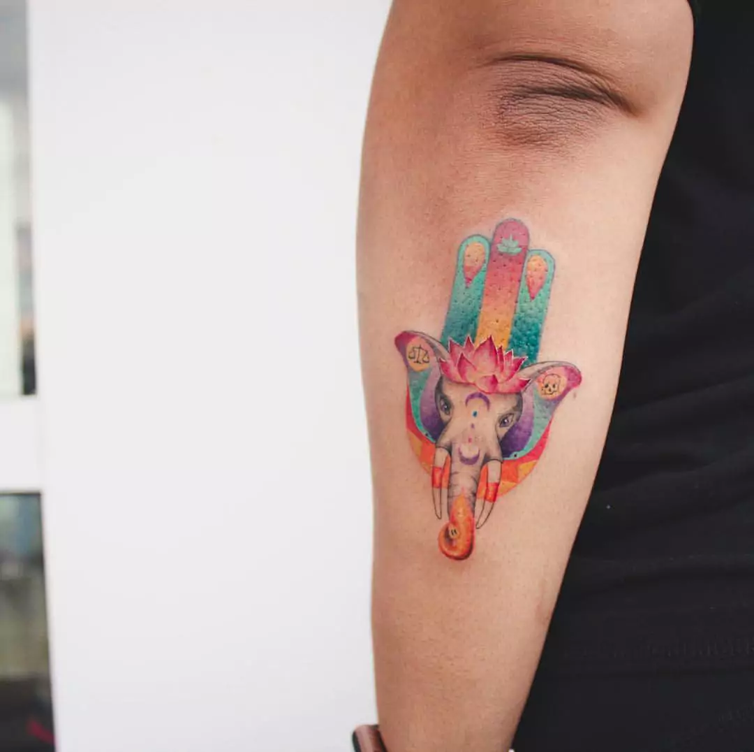 elephant and Hamsa hand tattoo