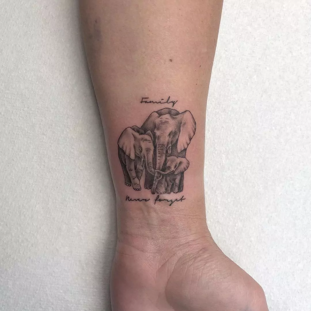 realistic family elephant tattoo with names