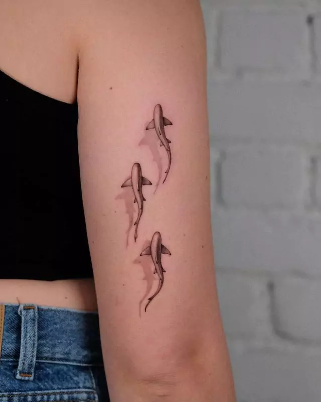 Three realistic shark hand tattoo