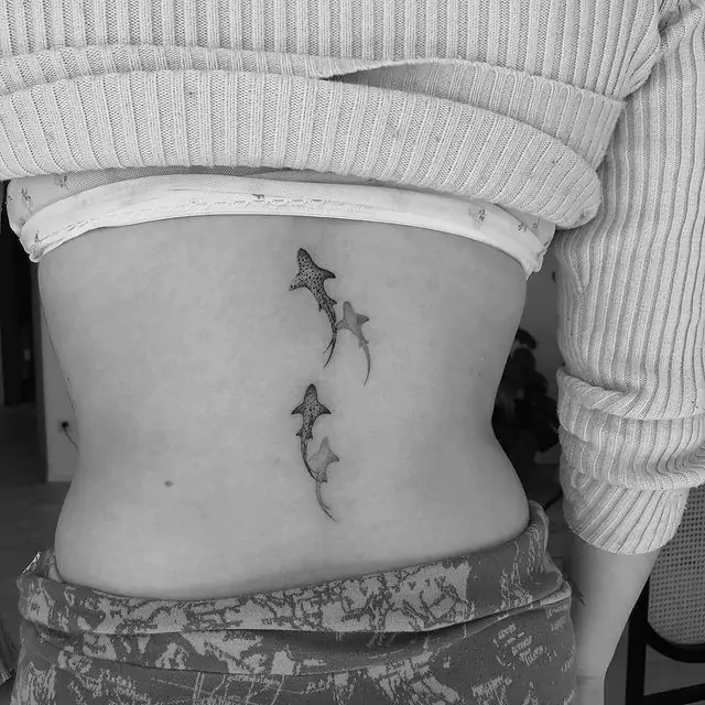 black sharks tattoo on the back
