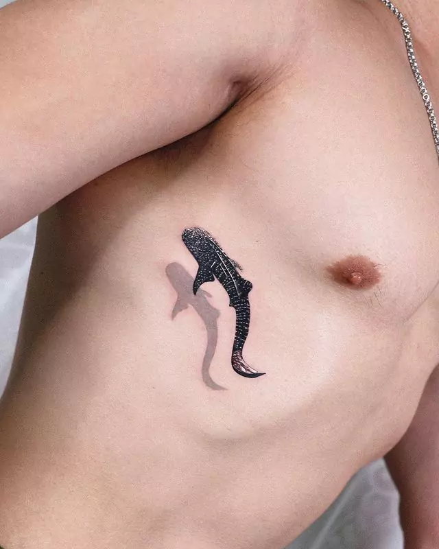 curvy whale shark tattoo on rib