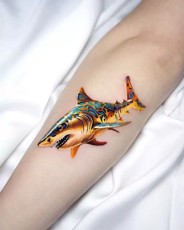 golden shark hand tattoo