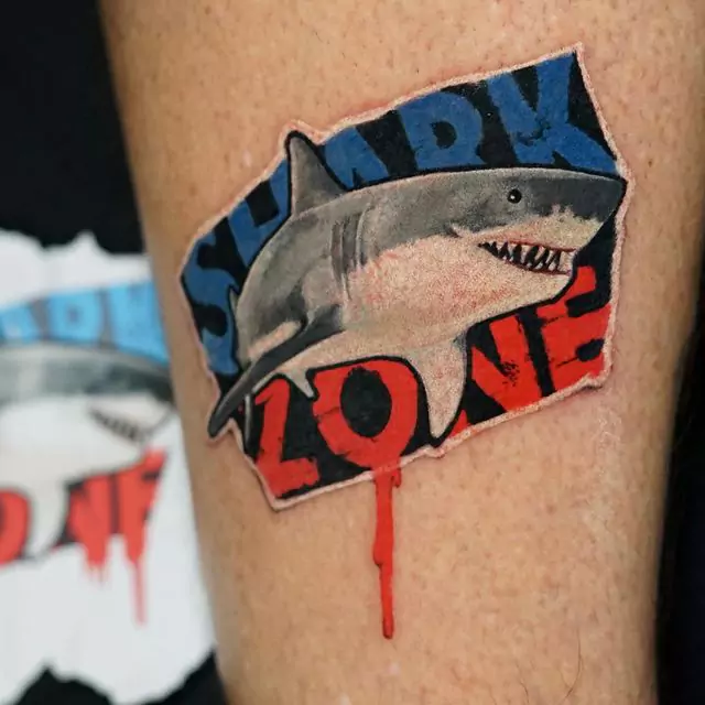 sticker shark tattoo on the leg