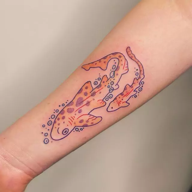 two cute sharks hand tattoo