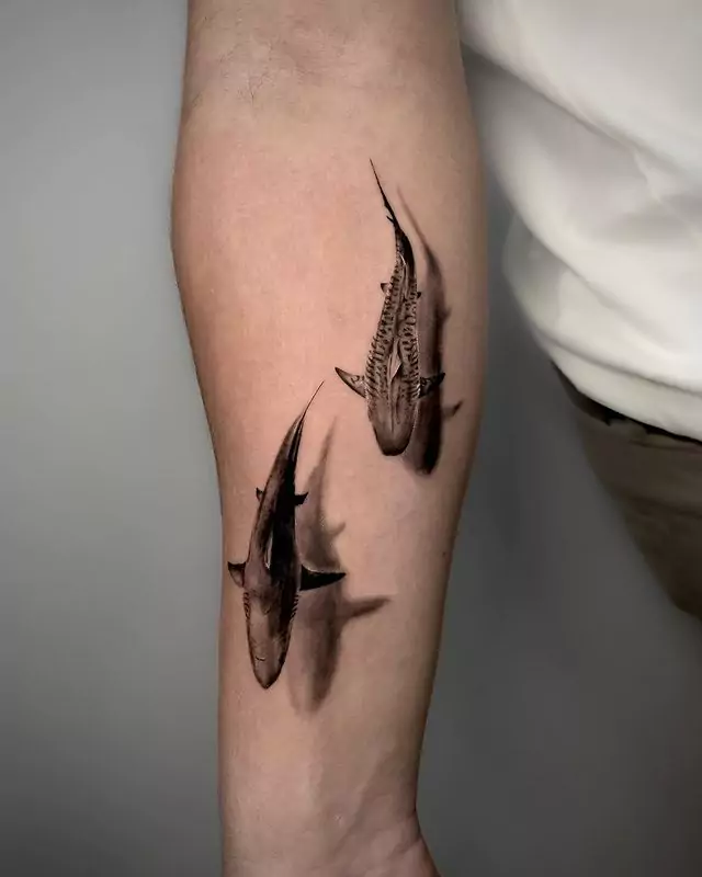 two sharks hand tattoo
