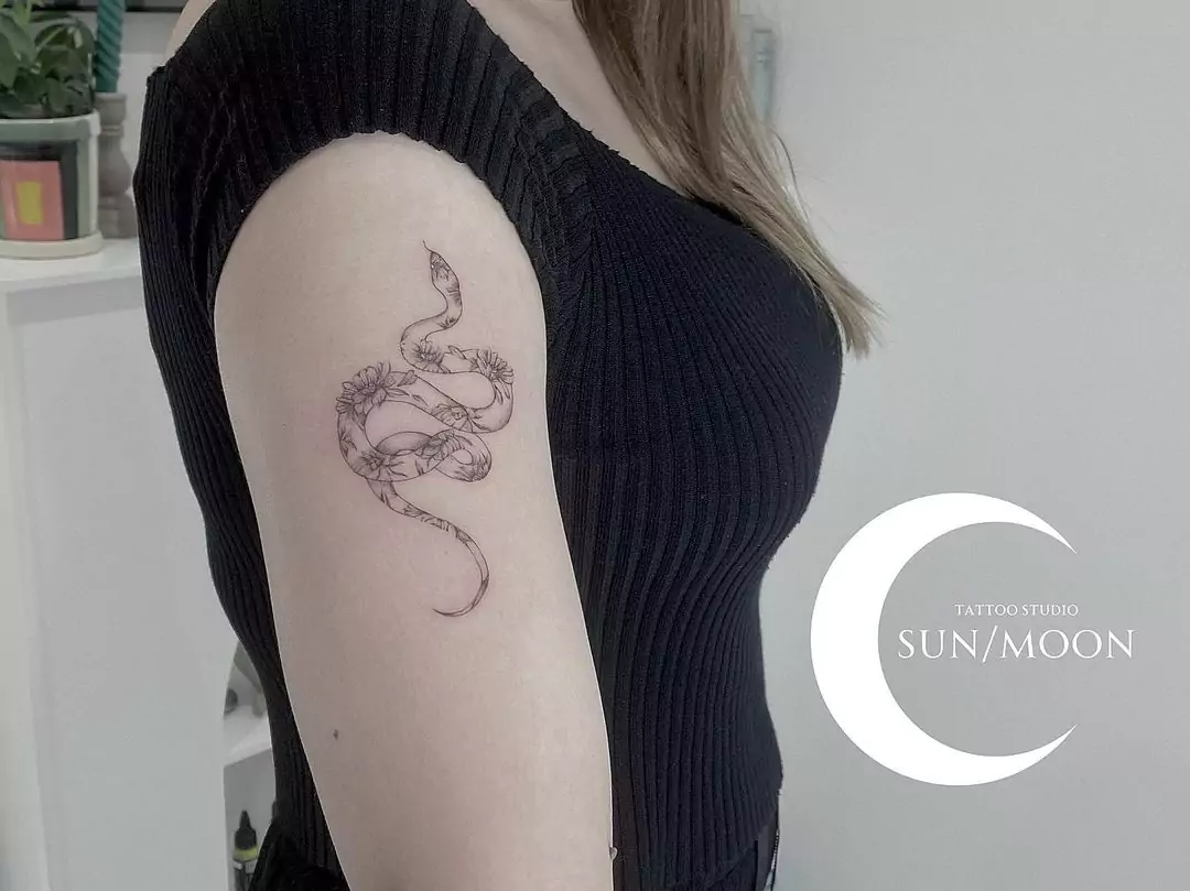 adorable snake tattoo for women