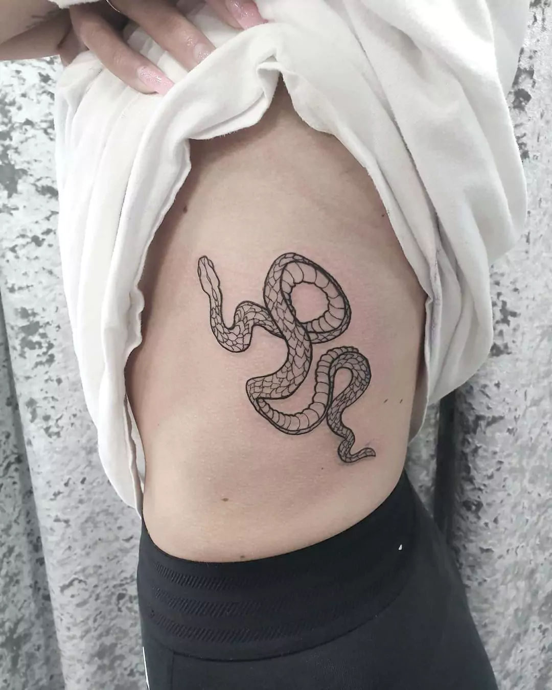 big snake rib tattoo