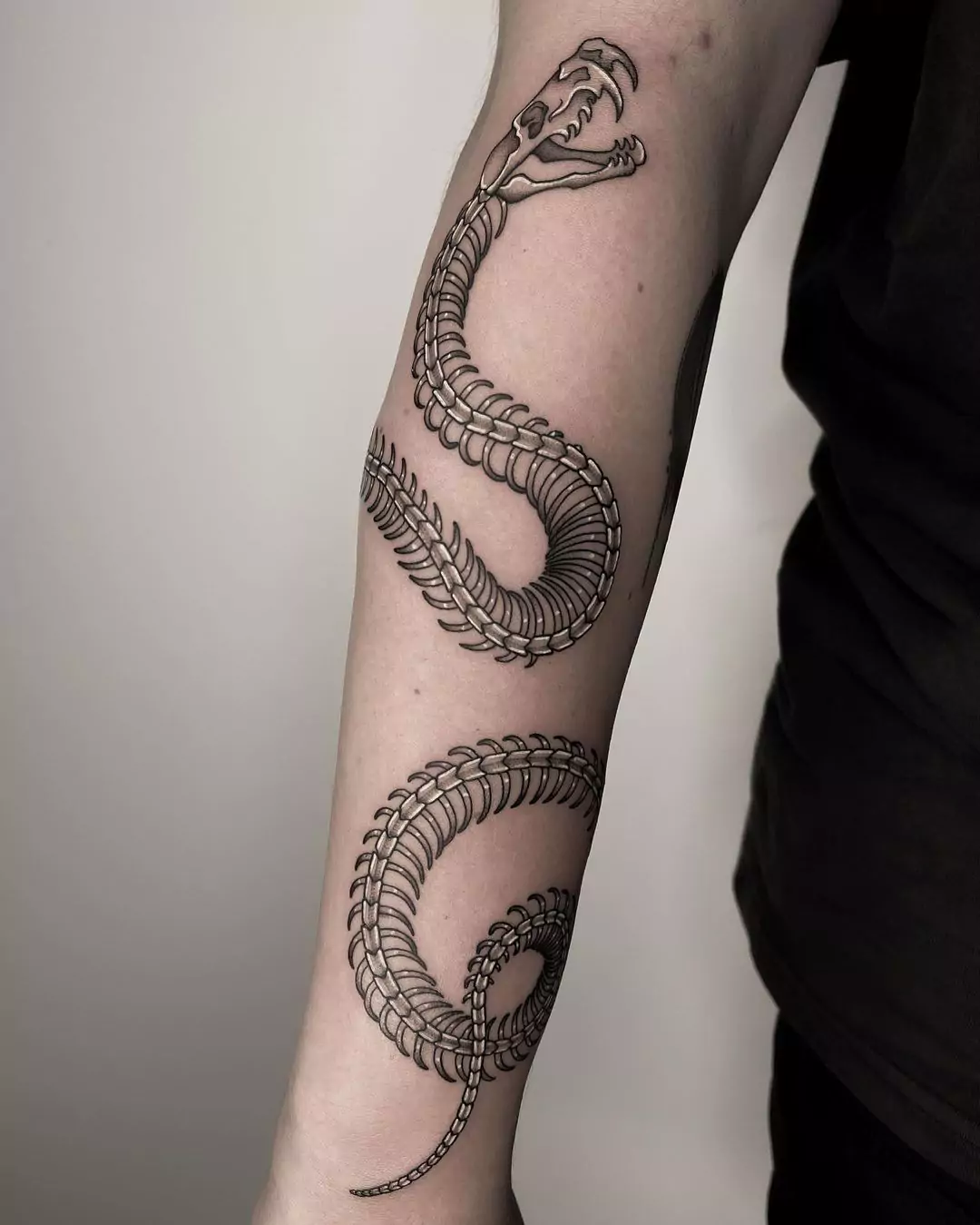 big snake skeleton hand tattoo