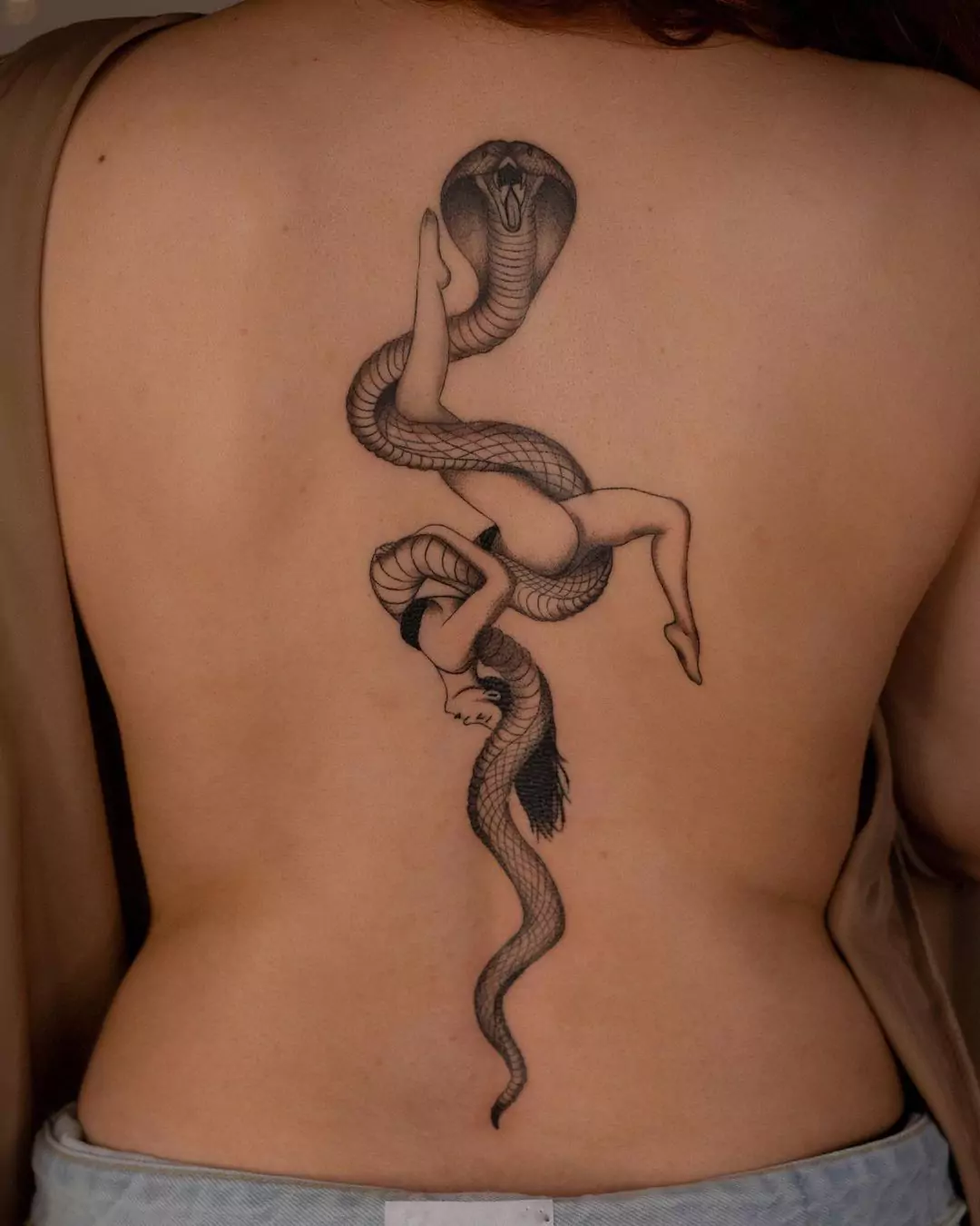 big snake tattoo with women