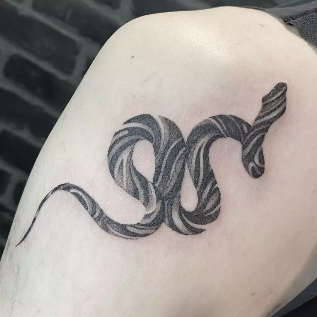 black small snake tattoo