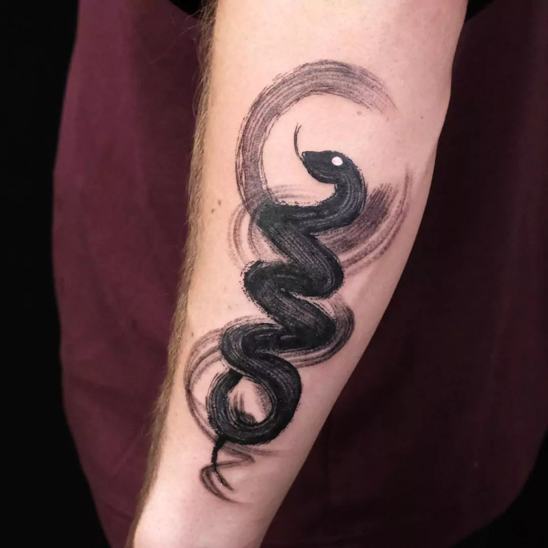 brush stroke snake tattoo