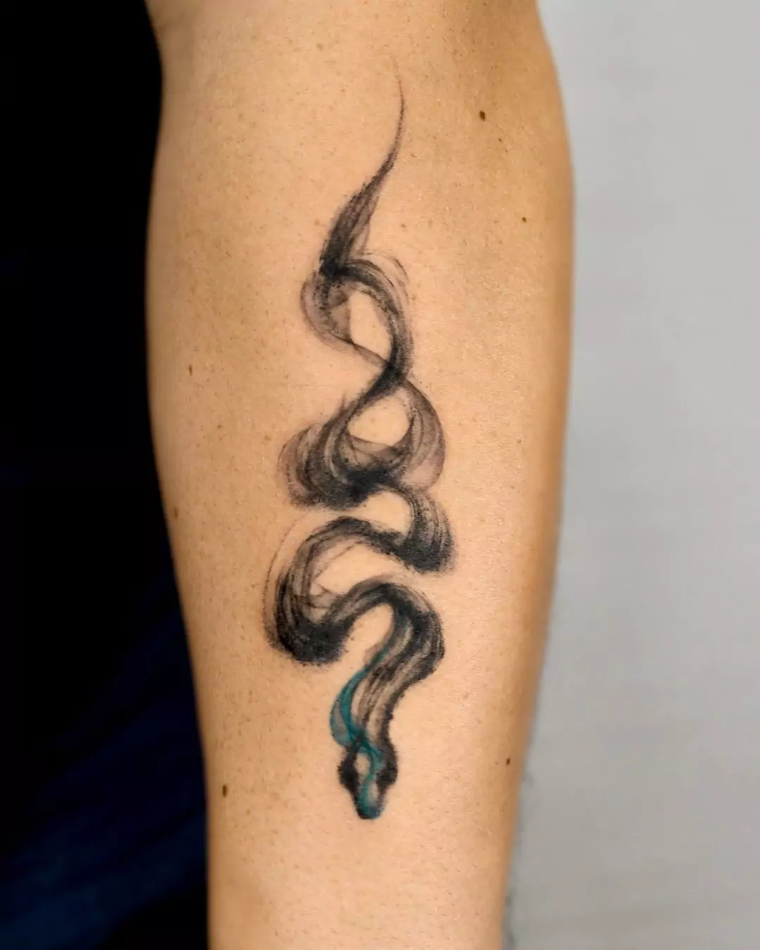 brush style snake hand tattoo