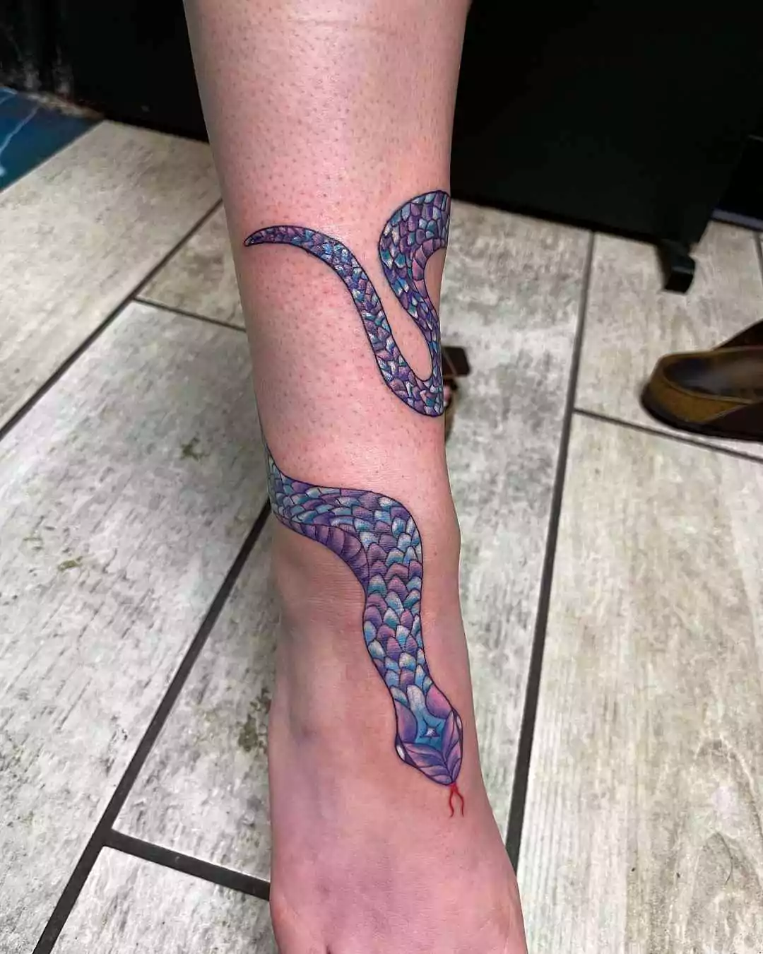 colorful snake leg tattoo