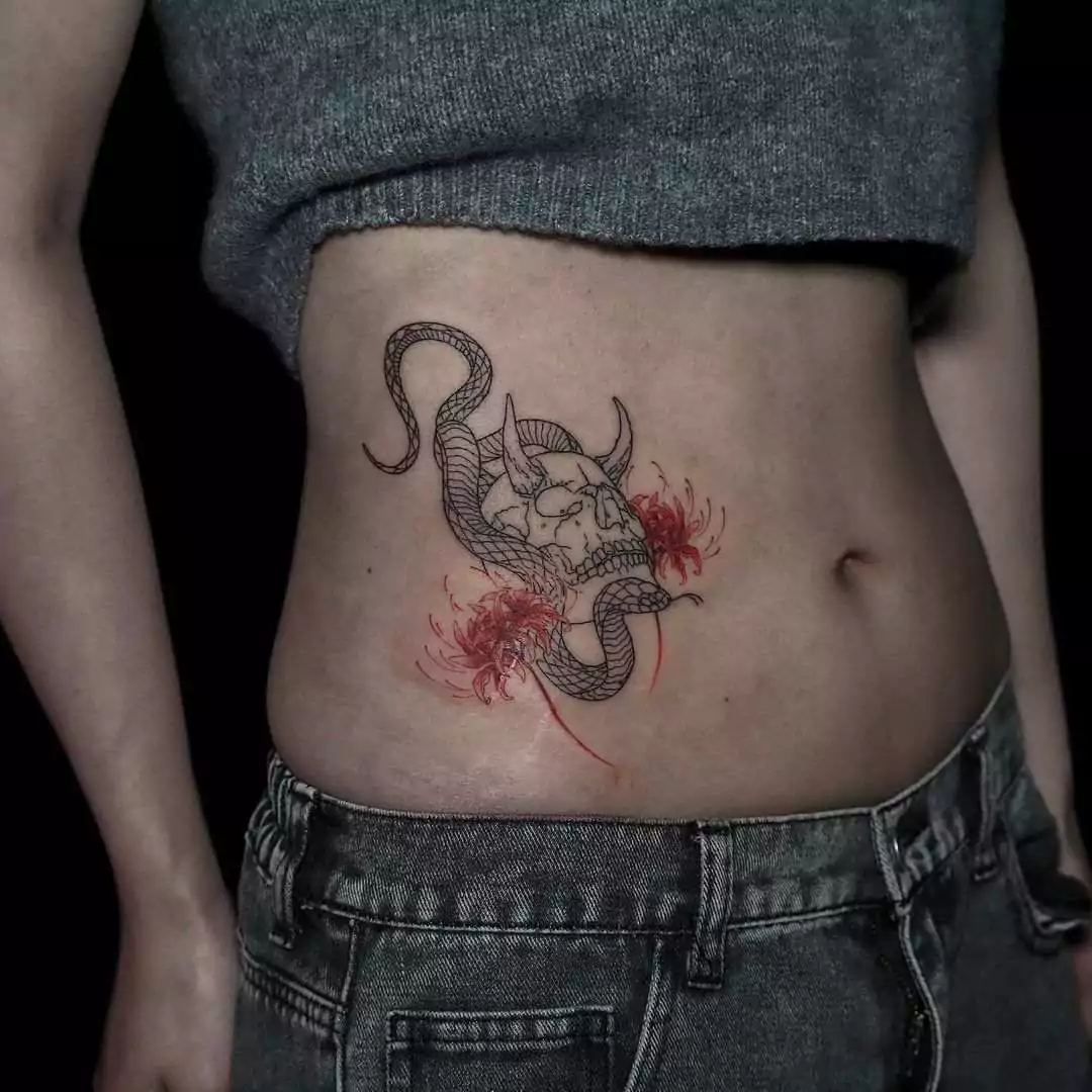 creative snake tattoo on the hip