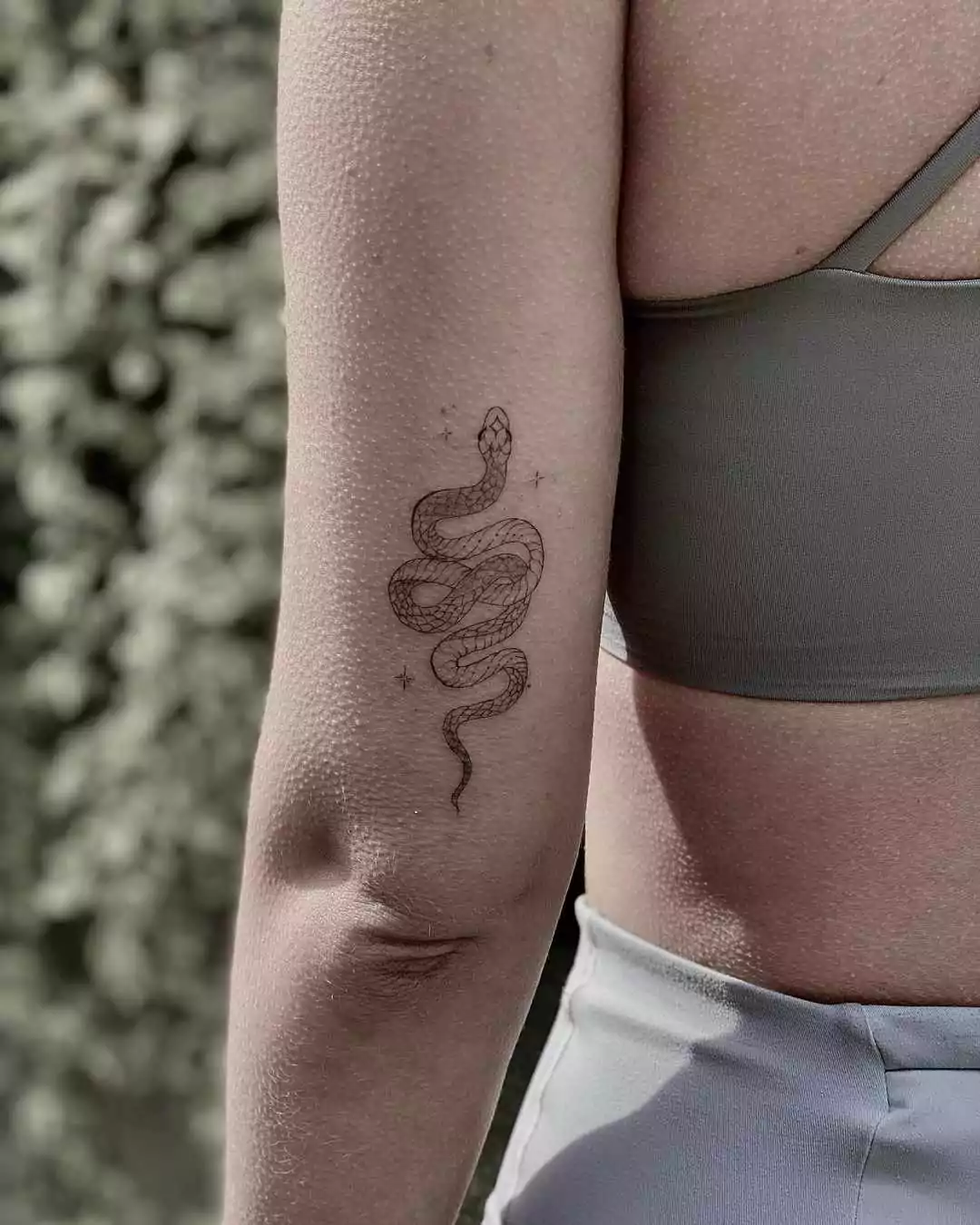 cute snake arm tattoo