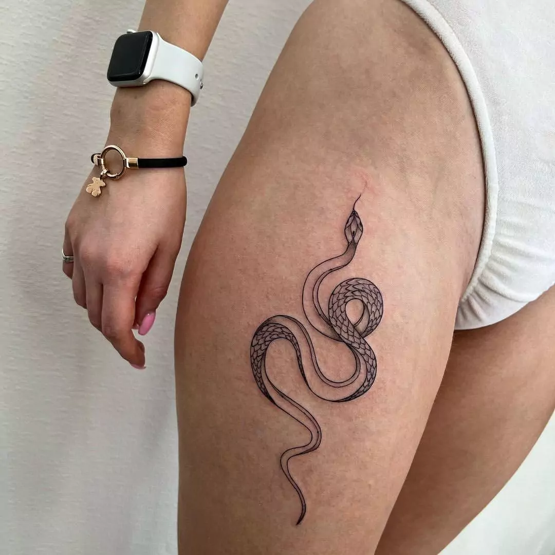 cute snake thigh tattoo