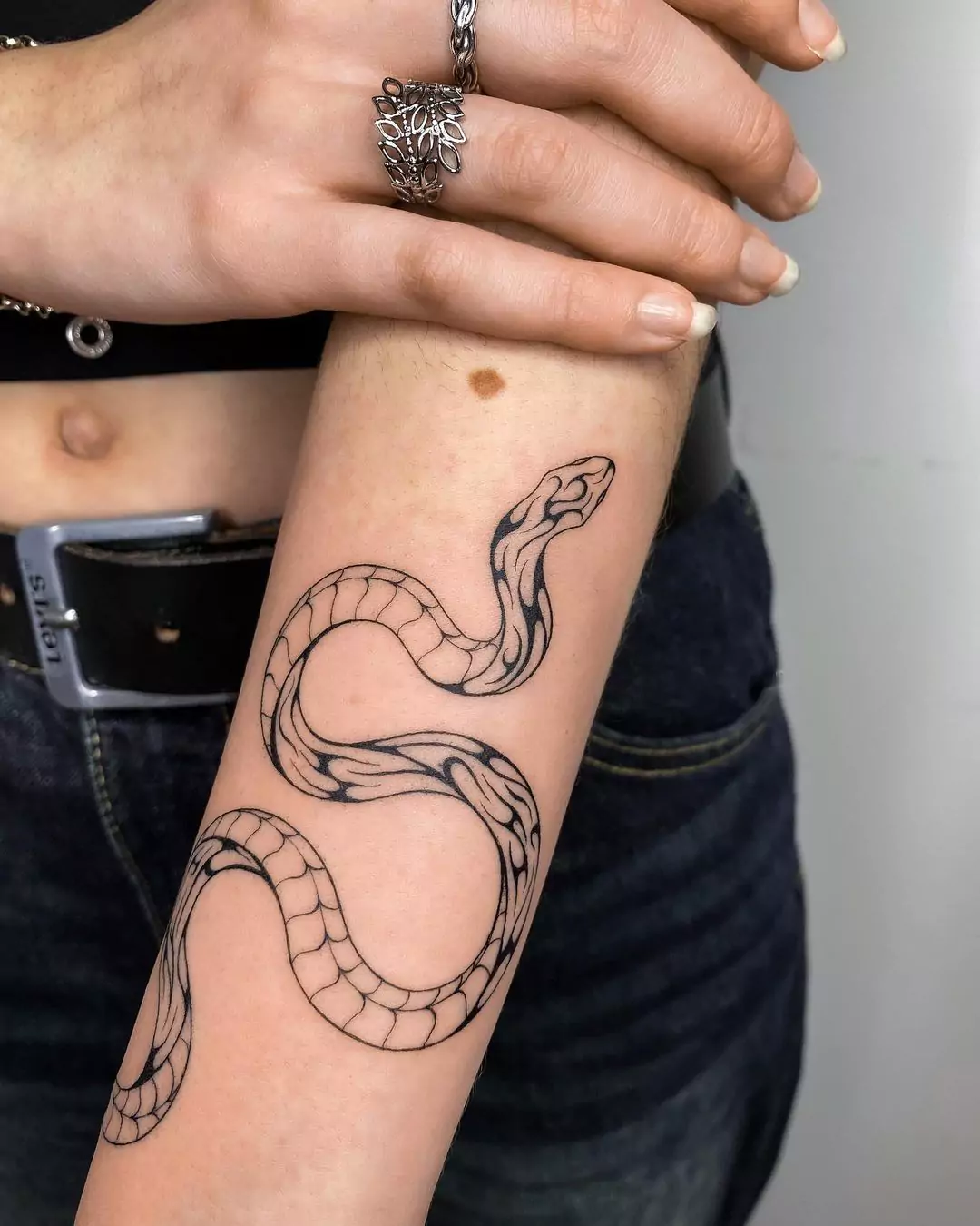 FineLine snake hand tattoo