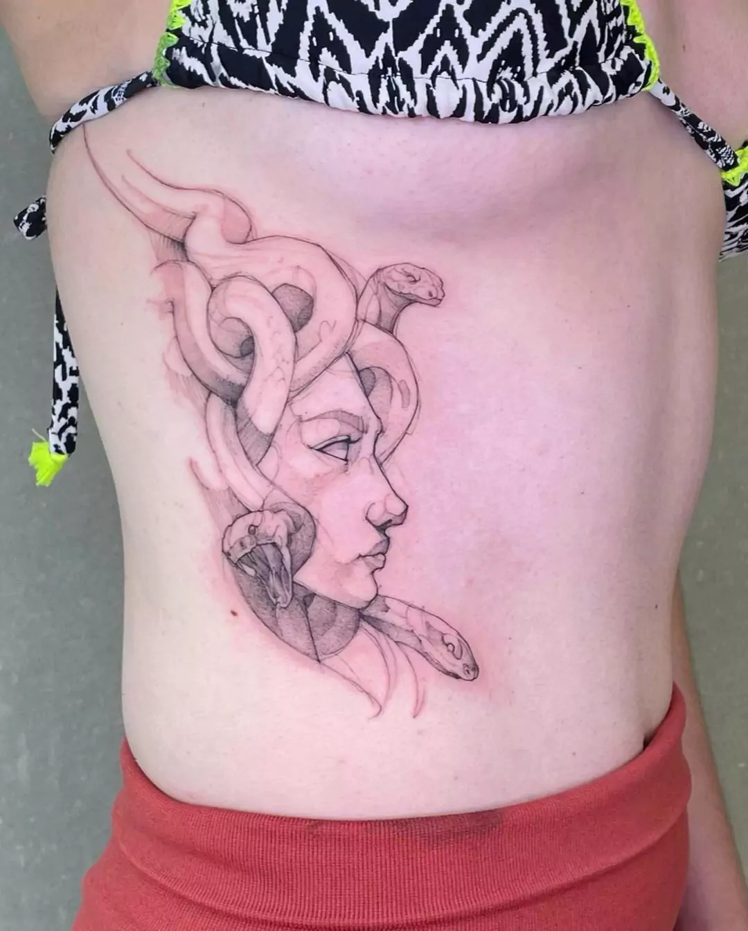 medusa tattoo on the rib