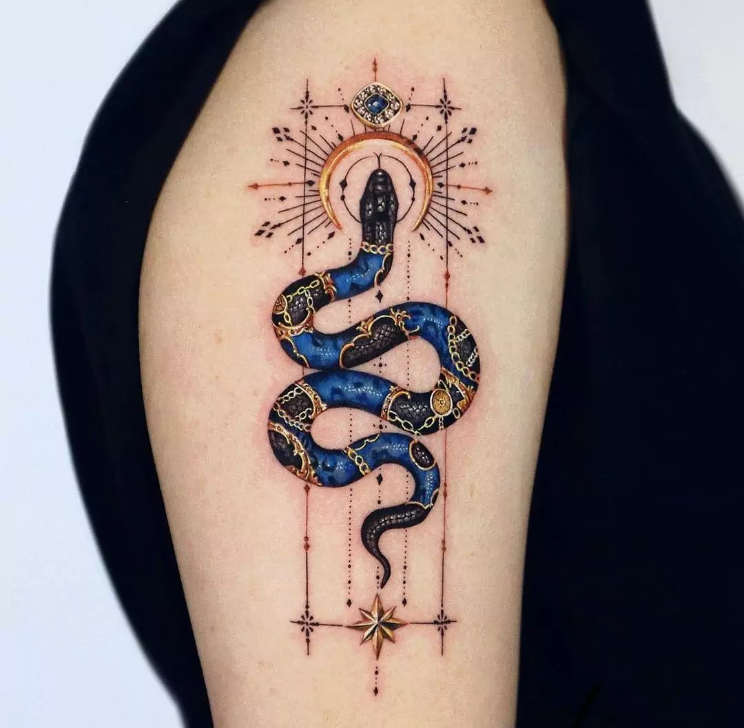 ornamental snake tattoo on the hand