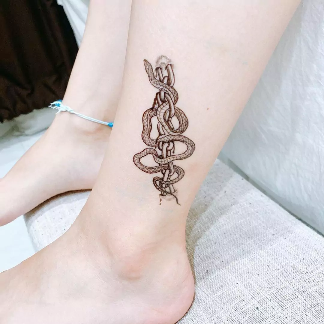 realistic chain and snake tattoo