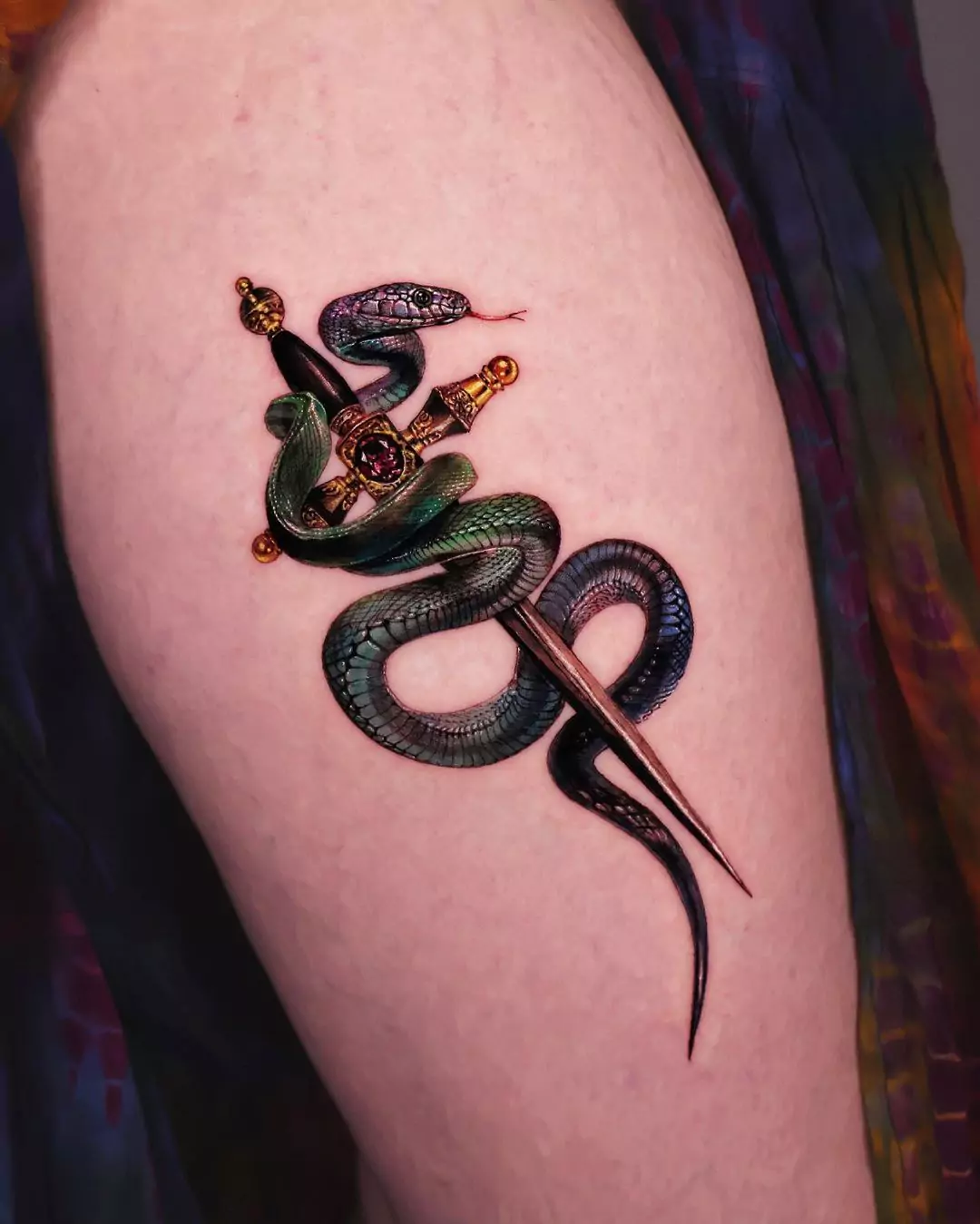 realistic snake and sword tattoo